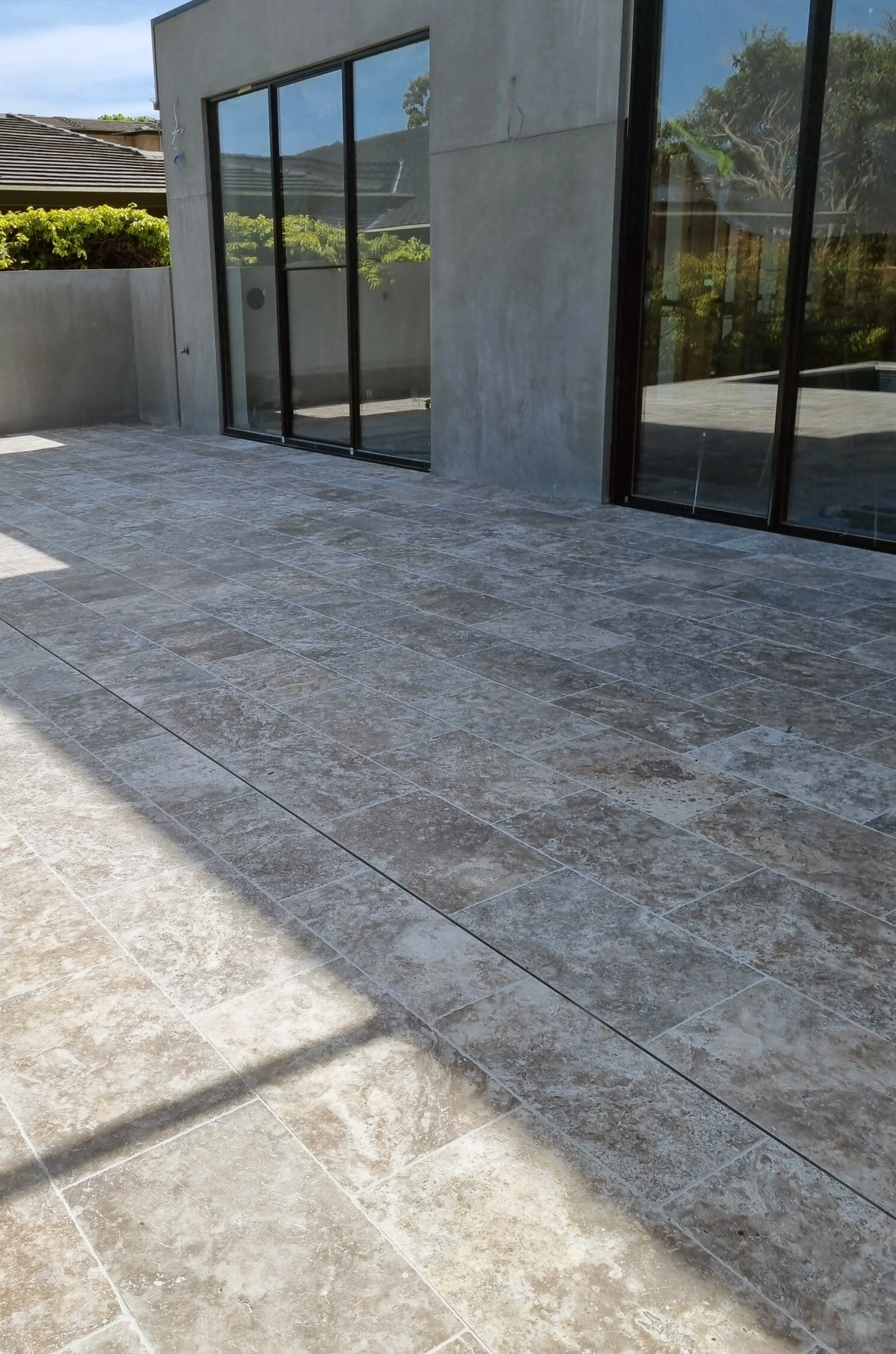 Captivating Silver Travertine from NeginStone: A pristine display of elegance, featuring subtle silver tones and intricate patterns. Elevate your space with this timeless natural stone masterpiece.